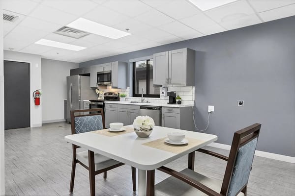 Bright and modern kitchen area with dining table