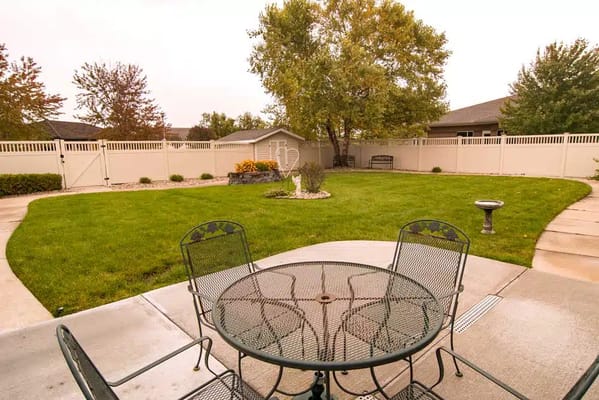 Outdoor patio with seating and garden area