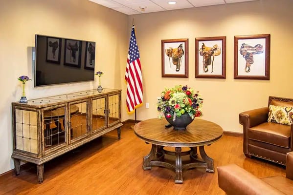 Cozy living room with floral arrangement and TV