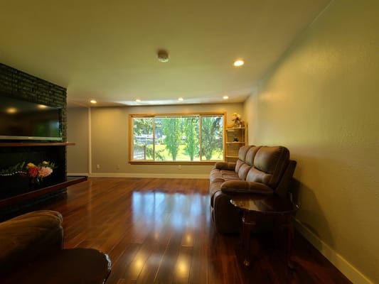 Interior view of a cozy living area with large windows