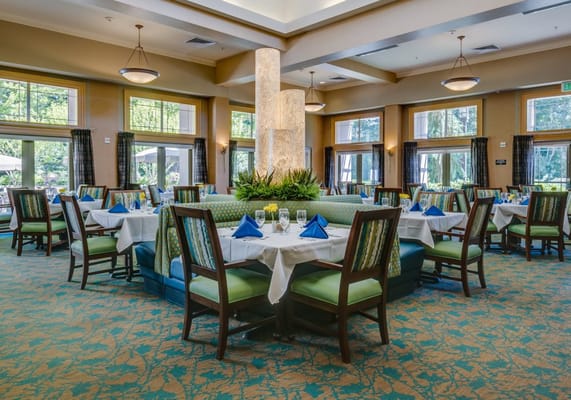 Elegant dining room setup with tables and green decor