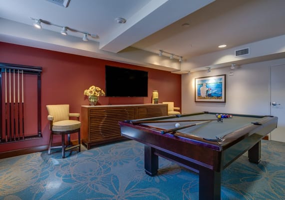 Interior common area with a pool table and seating