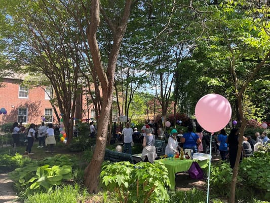 Residents and staff enjoying an outdoor celebration event