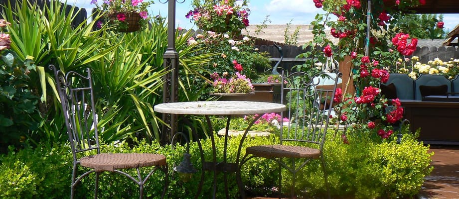 Quiet outdoor seating area surrounded by flowers