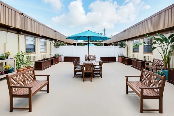 Outdoor seating area with tables and umbrellas