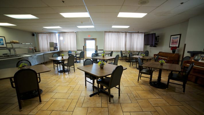Bright dining room setup with tables and chairs