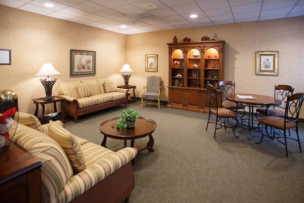 Comfortable living room with sofas and a dining table.