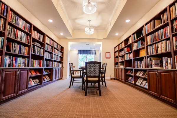 Interior view of a library with bookshelves and seating