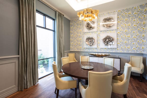 Bright dining room with circular table and modern decor