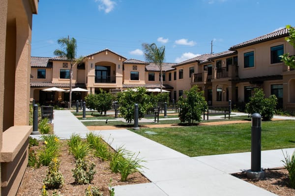 Outdoor courtyard area with seating and gardens