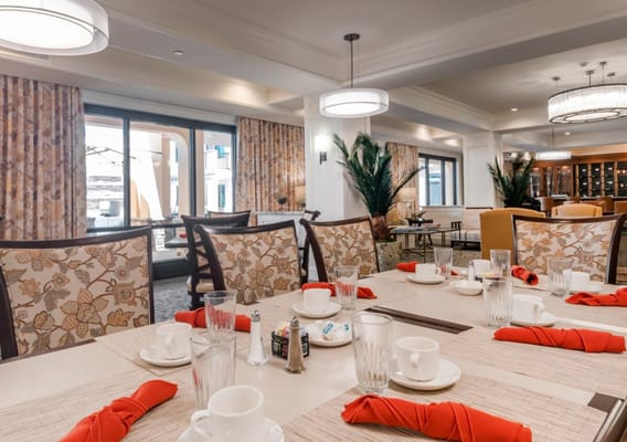 Dining room setup with tables and drinkware