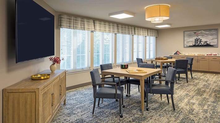 Bright common area with seating and games