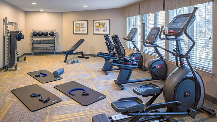 Well-equipped fitness room with exercise machines