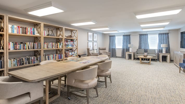 Bright common area with seating and bookshelves