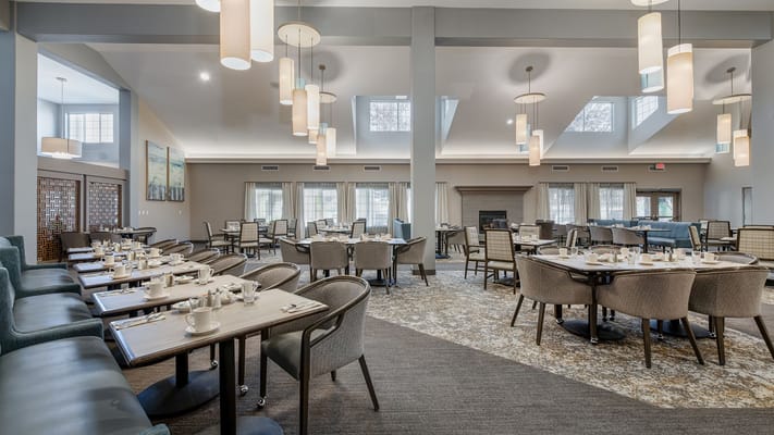 Dining room with tables set for breakfast
