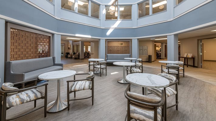Bright common area with tables and seating
