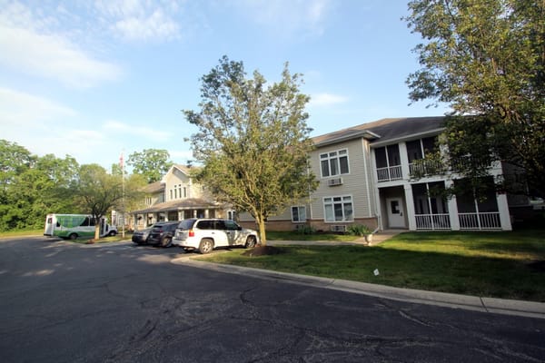 Exterior view of Bloom At Eagle Creek with parked vehicles