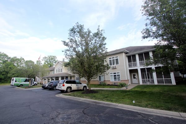 Exterior view of Bloom At Eagle Creek with parked vehicles