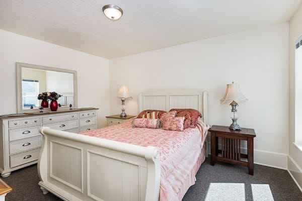 Well-furnished bedroom in a senior living space