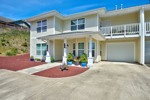 Exterior view of a residential facility with landscaped area
