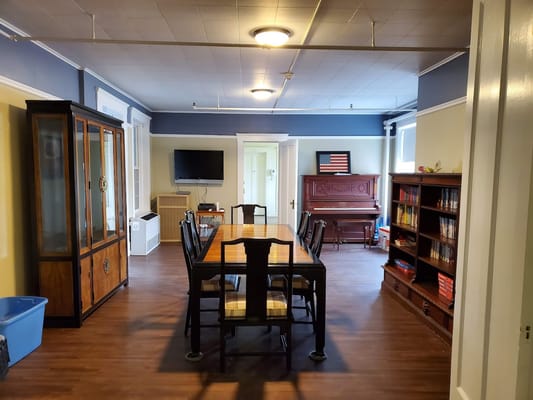 Common area with a dining table and seating