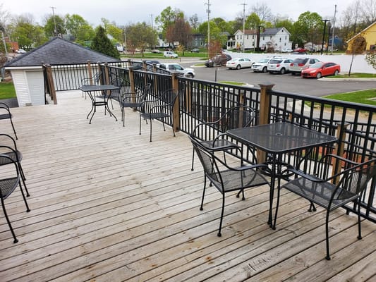 Outdoor seating area with tables and chairs