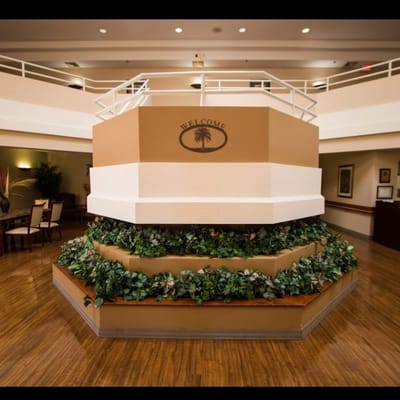 Indoor welcome area with plants and seating