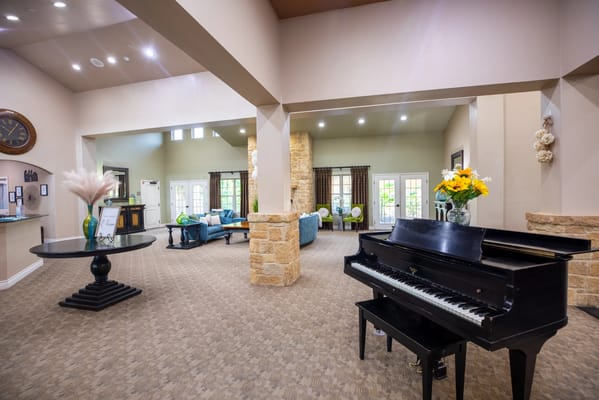 Interior common area with a piano and seating
