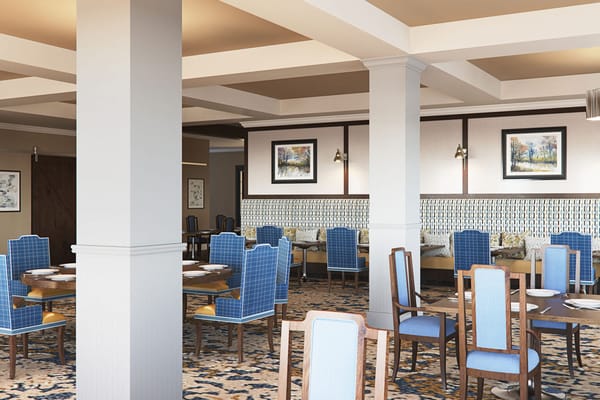 Spacious dining room with blue chairs and elegant decor.