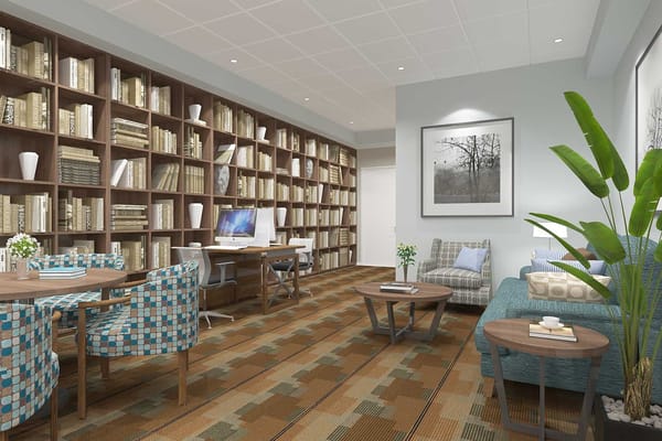 Cozy library with bookshelves, seating, and computers