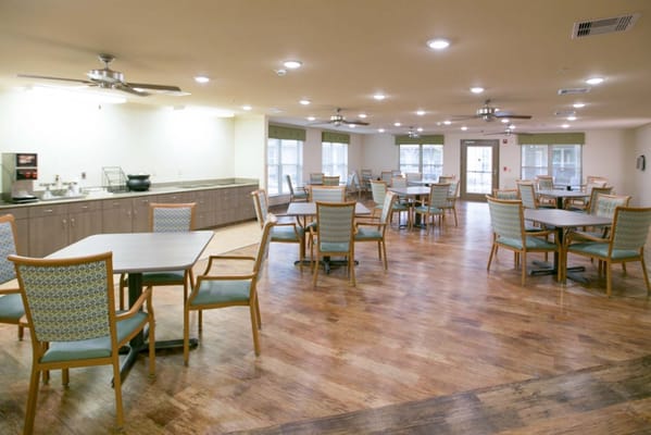 Bright and spacious dining area with tables and chairs