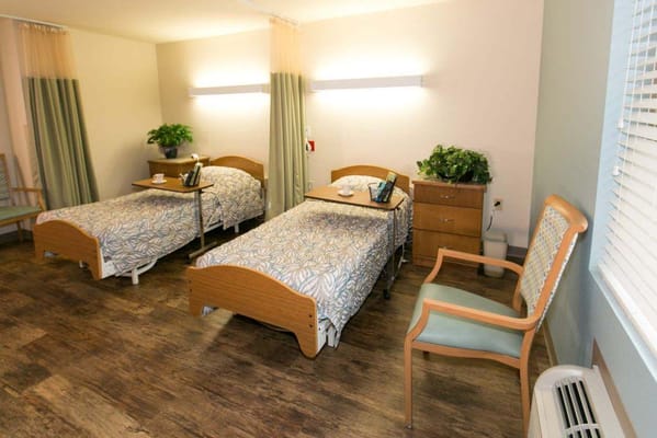 A well-furnished shared resident room with two beds