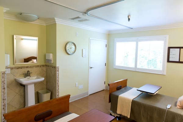 Interior view of a resident bedroom with a bathroom
