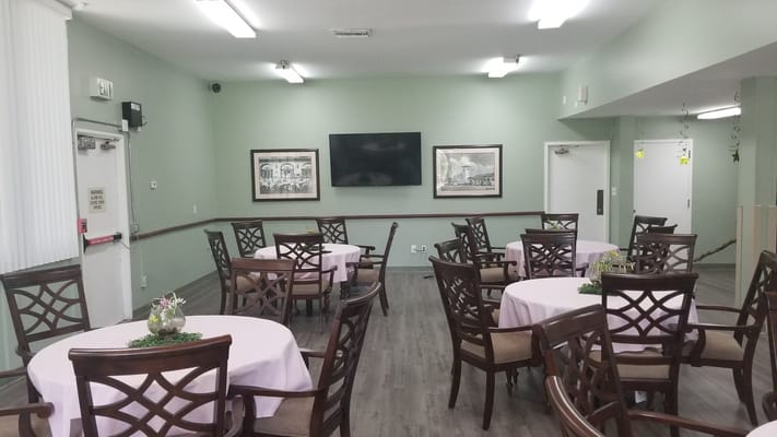 Interior view of a dining room with tables and chairs