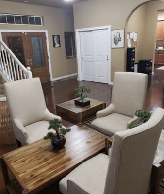 Comfortable seating area with two chairs and a wooden table