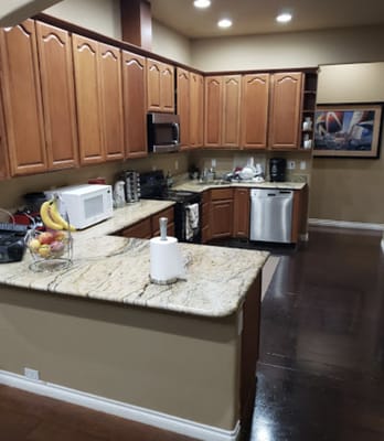 Modern kitchen with wooden cabinets and granite countertops