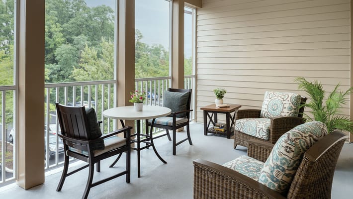 Cozy outdoor seating area with plant decor