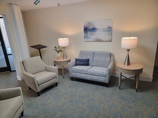 Cozy common area with seating and lamps