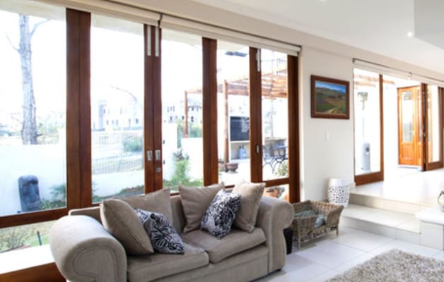 Bright living room with large windows and comfortable seating