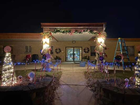 Festively decorated entrance with lights and candy canes