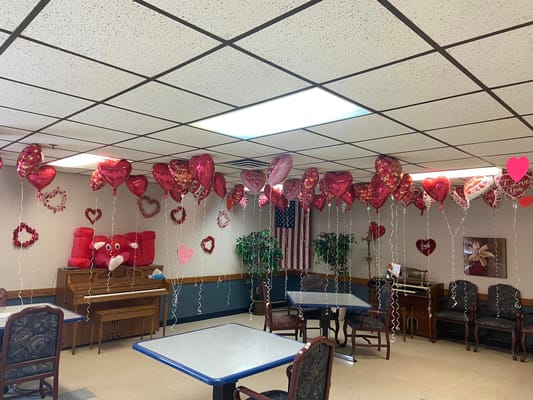 Decorated common area with Valentine's balloons