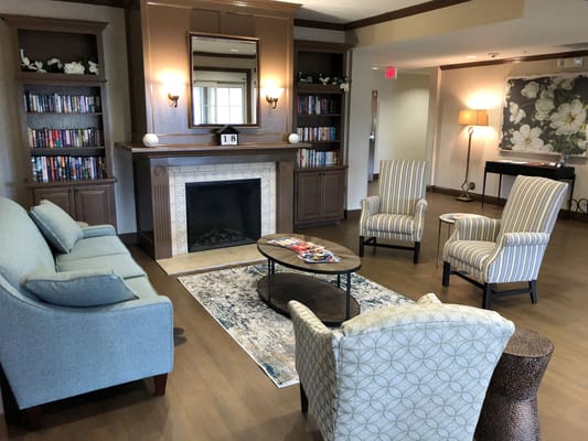 Cozy common area with bookshelves and seating