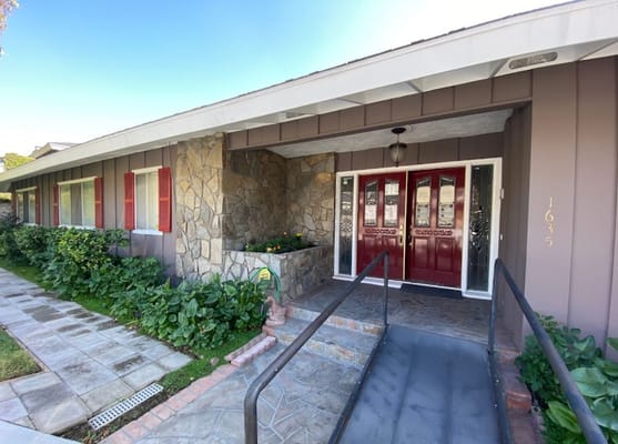 Entrance of a senior living facility with accessible ramp