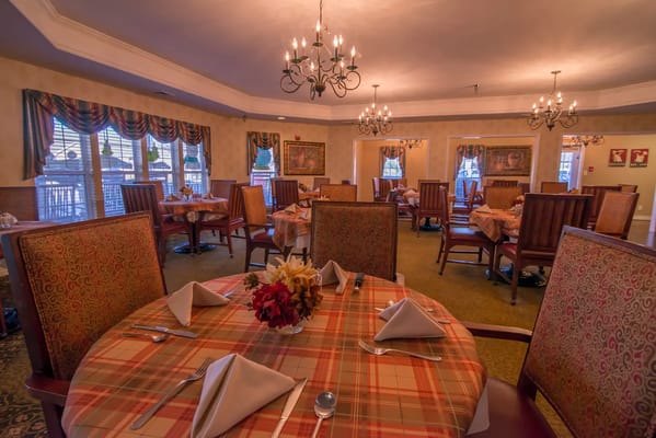 Dining room set with tables and chairs ready for service