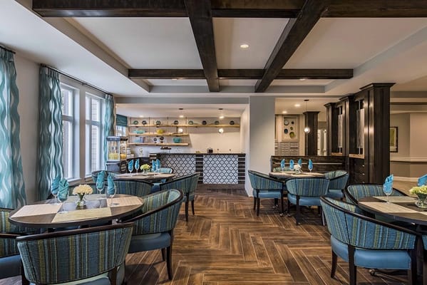 Interior dining area featuring blue chairs and decor