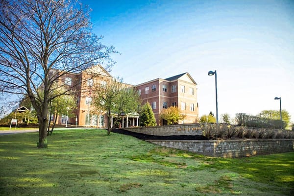 Building exterior of Mount Joseph at Waterville with greenery