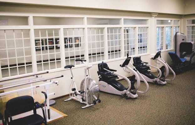Fitness equipment in a well-lit fitness center