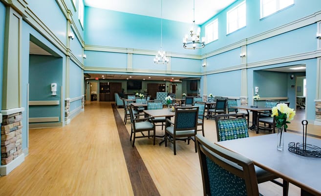 Spacious dining area with tables and blue walls