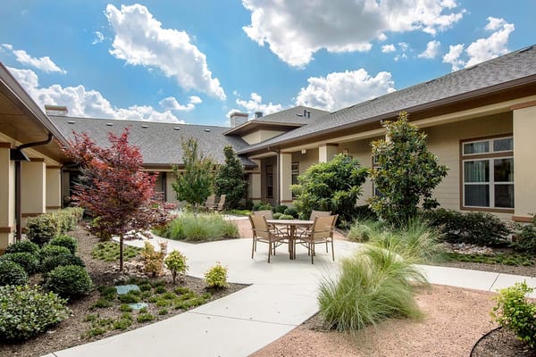 Outdoor courtyard with seating and landscaped garden
