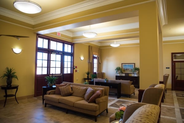 Cozy lobby with seating and plants at Ouachita Healthcare Rehabilitation Center